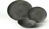 A set of dark gray ceramic plates and a bowl are arranged on a white background. Anteprima dell’immagine prodotto