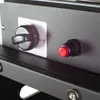 A close-up view of a black gas heater control panel, showing a rotary knob and an ignition button. Produktbild-Vorschau