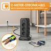 A black power strip tower is shown on a floor, connected to a wall outlet and charging a smartphone. A close-up inset shows the copper wires of the power cord. Produktbild-Vorschau