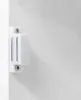 A close-up of a white magnetic cabinet catch attached to a white surface. Produktbild-Vorschau