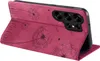 A pink flip case for a smartphone, decorated with a dandelion pattern, is shown open and standing on a white surface. Produktbild-Vorschau