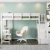 A white loft bed with a desk and shelves underneath, a beige office chair, and a light green wall. Produktbild-Vorschau