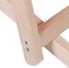 A close-up view of the wooden frame of a folding chair, showing the connection points secured with screws. Produktbild-Vorschau