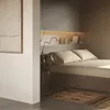 A bedroom scene with a bed, wall paneling, and decorative items. Anteprima dell’immagine prodotto