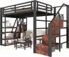 A loft bed with integrated shelves and stairs, set up in a room with a sofa and coffee table. Produktbild-Vorschau