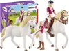 A set of Schleich Horse Club toys, including two horses and two figurines, with the product packaging in the background. Náhľad obrázku produktu