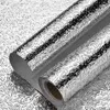 Two rolls of silver foil with a textured pattern. Produktbild-Vorschau
