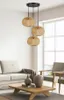 A living room scene with a sofa, coffee table, chairs, and a pendant light fixture. Náhled obrázku produktu