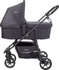 A black BabyGo Kombikinderwagen Style 3in1 is shown from the side against a white background. Produktbild-Vorschau