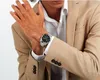 A man wearing a suit and watch. Produktbild-Vorschau