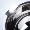 A close-up, abstract view of a shiny metal bowl. Voir les images du produit
