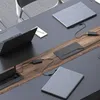 A modern conference table with laptops and power outlets. Produktbild-Vorschau