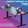 A gaming desk with a barbell placed on it to demonstrate its weight capacity, with LED lights on the desk. Voir les images du produit
