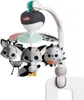 A baby mobile with stuffed animal toys attached to a stand, clipped onto the side of a crib. Voir les images du produit