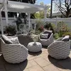 A patio set with chairs and a table under a pergola. Produktbild-Vorschau