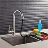A kitchen sink with a faucet and some fruit in a sink divider. Náhľad obrázku produktu