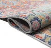 A close-up view of a rolled-up rug, showing its intricate pattern and textured material. Produktbild-Vorschau
