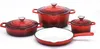 A set of red cast iron cookware, including pots and a frying pan, arranged on a white background. Anteprima dell’immagine prodotto