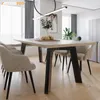 A dining table with chairs in a modern dining room setting. Produktbild-Vorschau
