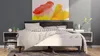 A bedroom scene with a bed, nightstands, and artwork. Anteprima dell’immagine prodotto