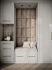 A built-in closet with a padded bench and decorative wall panels. Náhled obrázku produktu
