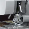 A close-up view of the needle and thread area of a sewing machine. Produktbild-Vorschau