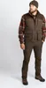 A man wearing outdoor clothing, including a vest, shirt, and pants, standing against a white background. Produktbild-Vorschau