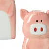 A close-up of two ceramic pig-shaped water diffusers for radiators. Produktbild-Vorschau