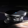 A close-up shot of a black wireless charger with a silver trim and a blue lightning bolt icon. Voir les images du produit