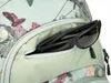 A close-up view of a backpack pocket with sunglasses inside. Produktbild-Vorschau