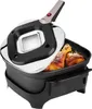 An electric roaster with chicken legs inside, with the lid partially open. Anteprima dell’immagine prodotto