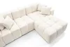 A cream-colored sectional sofa with tufted cushions is shown from a high-angle perspective against a white background. Náhled obrázku produktu