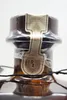 A close-up shot of the top of a bottle, focusing on the cap and seal. Náhled obrázku produktu