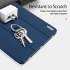A close-up shot of a blue tablet case with keys and a charger plug on it, with marketing text in the upper right corner. Produktbild-Vorschau