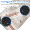 Two robotic vacuum cleaners on a wooden floor, with an arrow indicating movement. Produktbild-Vorschau
