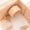 Interior view of a wooden hamster cage with a wooden tunnel. Podgląd zdjęcia produktu