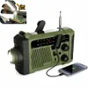 A green emergency radio with a flashlight and a phone charging from it. Produktbild-Vorschau