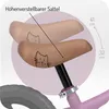 A close-up view of a bicycle saddle, showing its adjustable height feature and a cute cat illustration. Produktbild-Vorschau