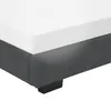 A close-up view of the corner of a bed frame with a white mattress on top. Produktbild-Vorschau