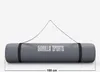 A rolled-up yoga mat with a carrying strap, displayed against a plain white background. Produktbild-Vorschau