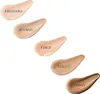Swatches of foundation shades on a white background. Voir les images du produit