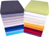 A stack of fitted sheets in various colors, arranged in two columns. Produktbild-Vorschau