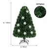A green artificial Christmas tree with snowflake ornaments and a star topper, shown on a white background with measurement indicators. Voir les images du produit