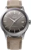 A close-up studio shot of an Orient watch with a brown strap. Voir les images du produit
