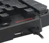 A close-up view of a black Redragon gaming keyboard with a USB cable plugged in. Produktbild-Vorschau