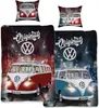 Collage of Volkswagen bus bedding and pillows with a city street background. Náhľad obrázku produktu