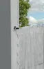 A close-up view of a window with a black curtain rod and white lace curtains. Produktbild-Vorschau