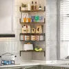 A corner kitchen shelf unit displaying various kitchen items like bottles, glasses, food packaging, and a toaster. Produktbild-Vorschau
