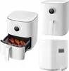 A collage of three images showing a white Xiaomi Mi Smart Air Fryer from different angles, with one image showing chicken wings inside the basket. Podgląd zdjęcia produktu