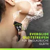 A close-up shot of a person shaving their neck with a Gillette razor, with shaving foam on their face and neck. Text overlays highlight product features. Produktbild-Vorschau